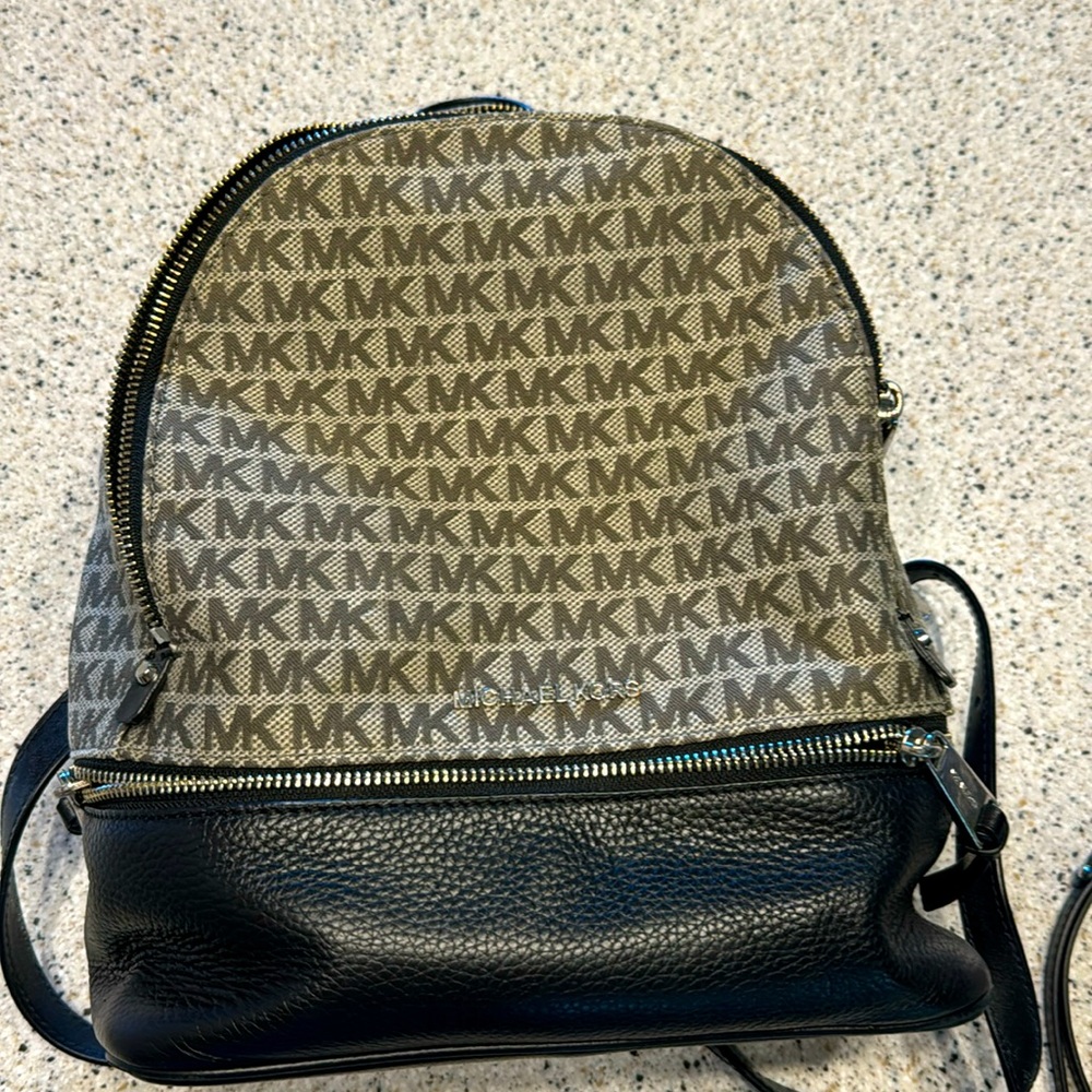 Micheal Kors small backpack purse. 3 Pockets. Zipper pocket inside. Like New!